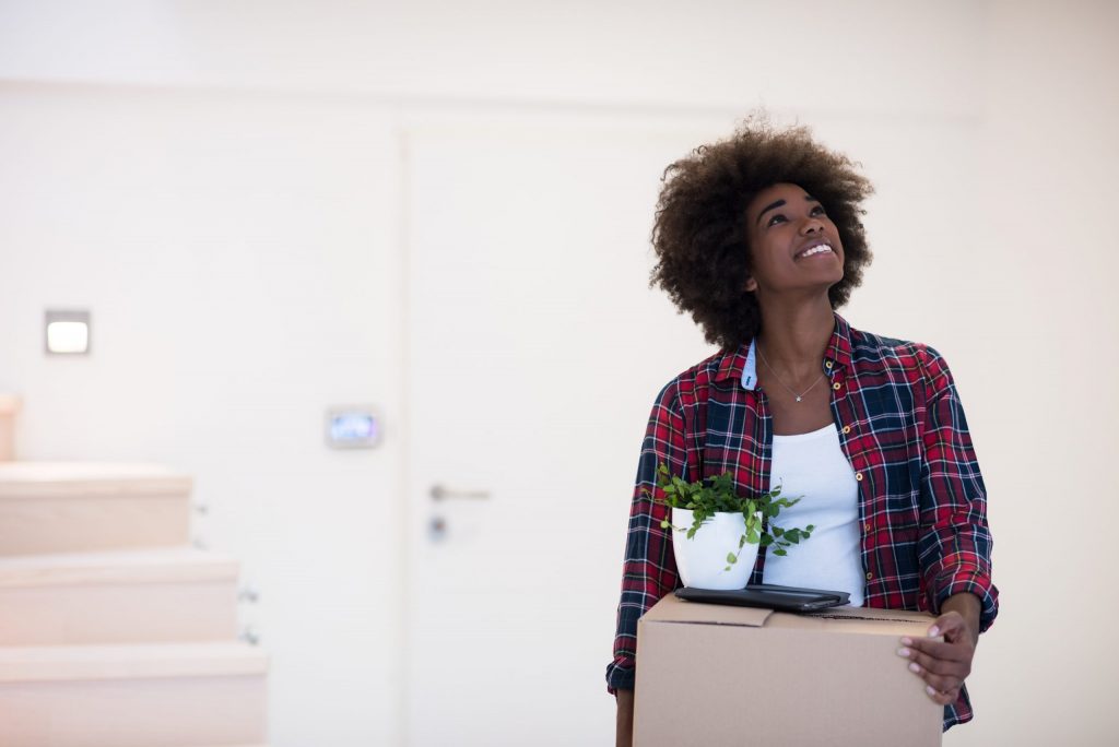 Young woman moving into home