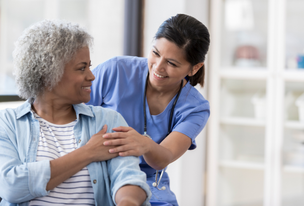 Image of a nurse discussing Medicare Part C benefits with a senior patient in a hospital, illustrating healthcare coverage and support.