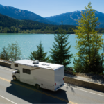 RV with RV insurance coverage traveling down scenic road, embodying freedom and adventure on the open road.