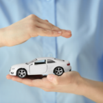 Woman holding a toy car in her hand, symbolizing protection and security after car insurance cancellation