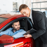 Man reviewing contract for rental car coverage after an accident