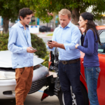 Drivers exchanging insurance information after an accident