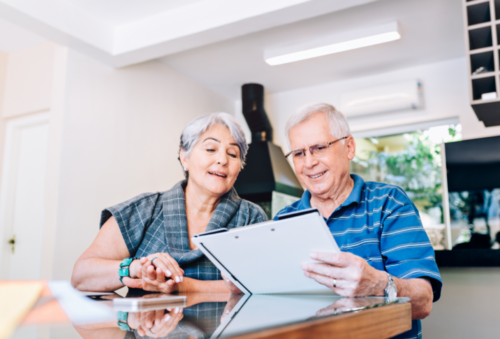 Senior couple reading about Medicare Giveback Benefit