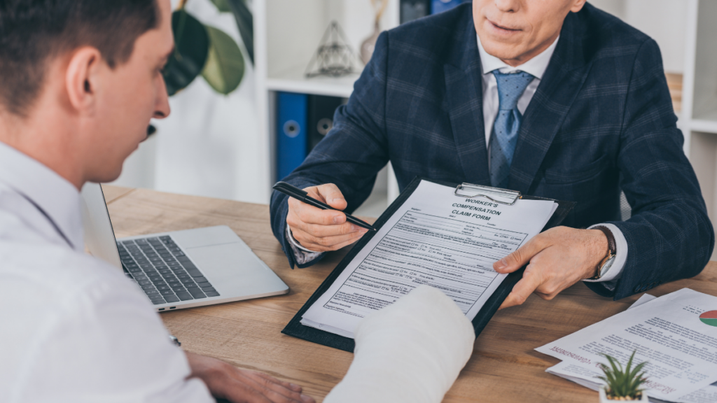 Worker getting assistance with workers' compensation form.