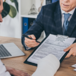 Worker getting assistance with workers' compensation form.